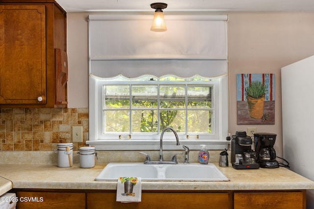 725 Avenue Ave E, Danville, PA 17821 - kitchen featuring brown cabinets, light countertops, and tasteful backsplash