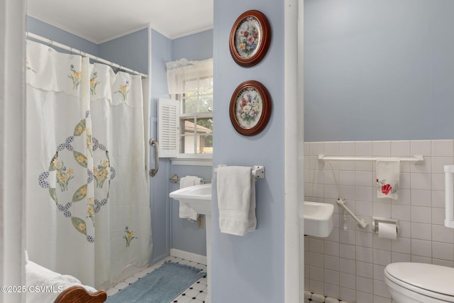 725 Avenue Ave E, Danville, PA 17821 - bathroom featuring a shower with shower curtain, tile walls, and crown molding