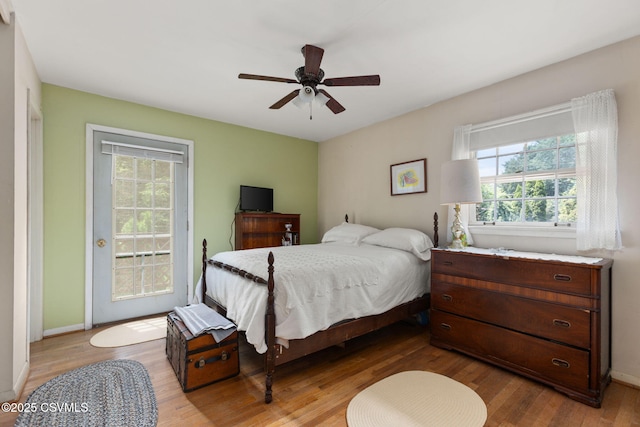 725 Avenue Ave E, Danville, PA 17821 - bedroom with access to outside, multiple windows, and wood finished floors