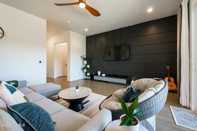 11512 Cepheus Rd, Bellemont, AZ 86015 - living area featuring recessed lighting, an accent wall, light wood-type flooring, baseboards, and ceiling fan