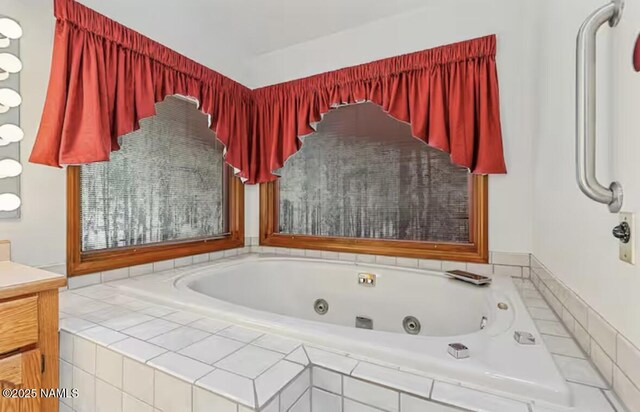 3120 W Tami Ln, Flagstaff, AZ 86001 - bathroom featuring a whirlpool tub and vanity