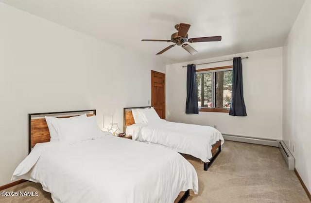 3120 W Tami Ln, Flagstaff, AZ 86001 - bedroom featuring carpet floors, a baseboard radiator, and baseboards