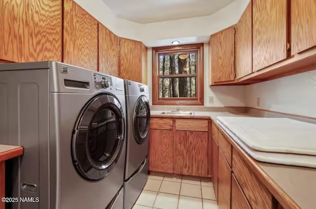 3120 W Tami Ln, Flagstaff, AZ 86001 - laundry room featuring washing machine and dryer, light tile patterned floors, and cabinet space