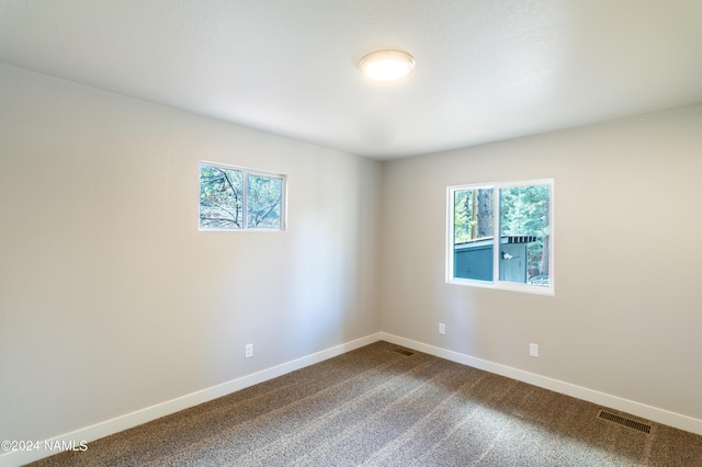 unfurnished room featuring carpet flooring