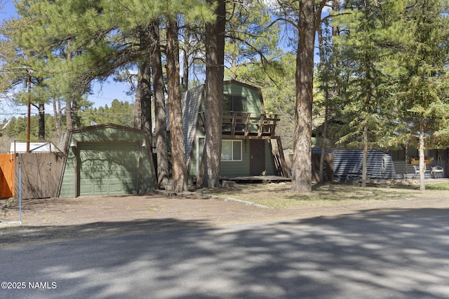 937 Osage, Flagstaff, AZ 86005 - a-frame style home featuring an outdoor structure, a garage, fence, driveway, and a deck