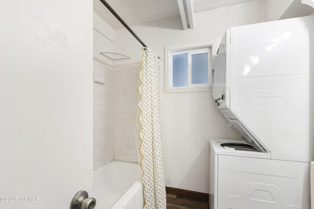 937 Osage, Flagstaff, AZ 86005 - bathroom featuring estacked washer and dryer, wood finished floors, shower / tub combo with curtain, and beamed ceiling