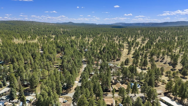 937 Osage, Flagstaff, AZ 86005 - aerial view of property and surrounding area with a heavily wooded area and mountains