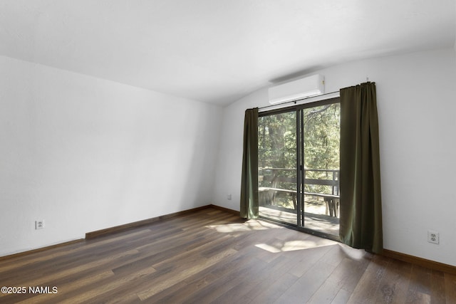 937 Osage, Flagstaff, AZ 86005 - spare room with an AC wall unit, wood finished floors, lofted ceiling, and baseboards