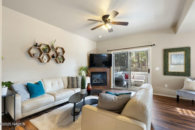 4435 E Savannah Cir, Flagstaff, AZ 86004 - living room with wood finished floors, ceiling fan, baseboards, and a glass covered fireplace