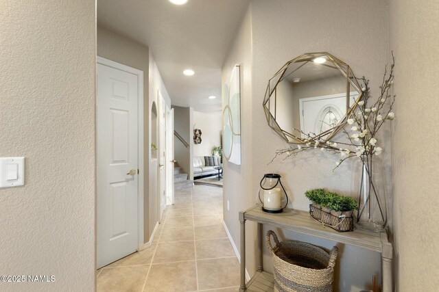 4435 E Savannah Cir, Flagstaff, AZ 86004 - corridor featuring a textured wall, stairs, recessed lighting, and light tile patterned flooring