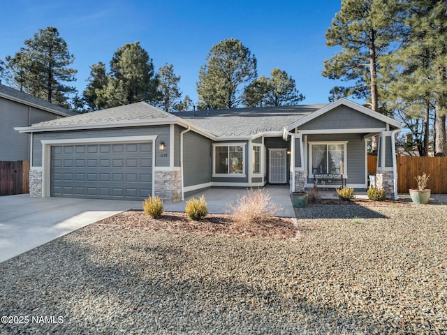 view of front of property featuring a porch and a garage