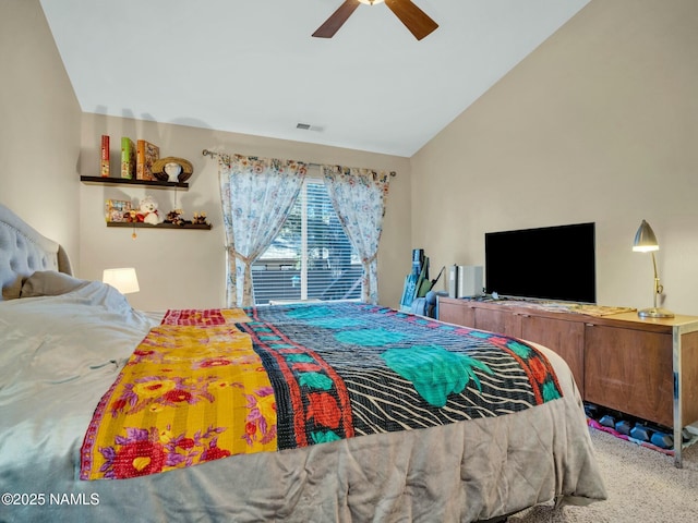 carpeted bedroom featuring vaulted ceiling and ceiling fan