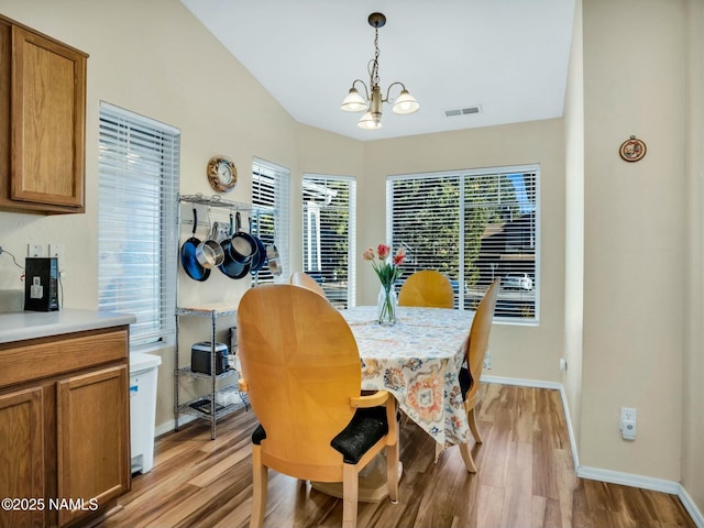 dining room featuring a chandelier and light wood-type flooring