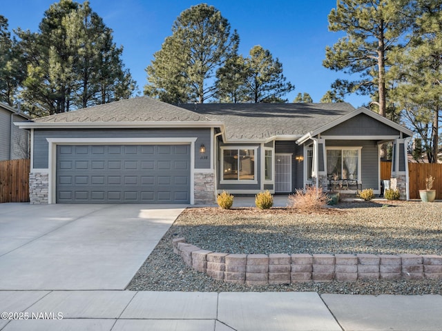 view of front of home featuring a garage and a porch