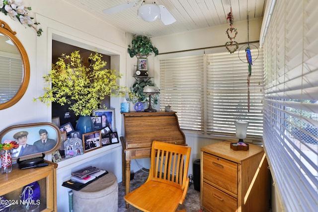 sitting room featuring ceiling fan