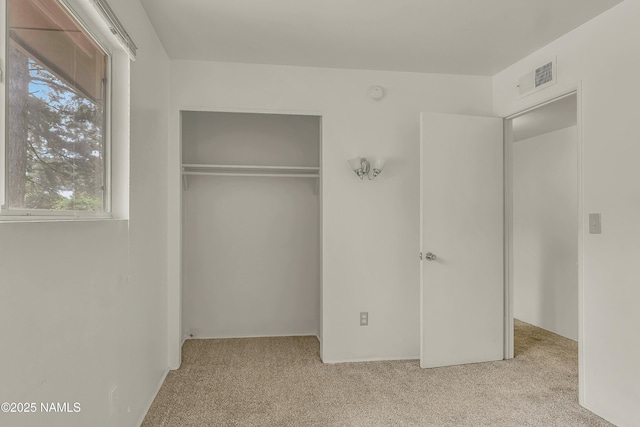 3494 N Andes Dr, Flagstaff, AZ 86004 - unfurnished bedroom with carpet flooring, multiple windows, and a closet