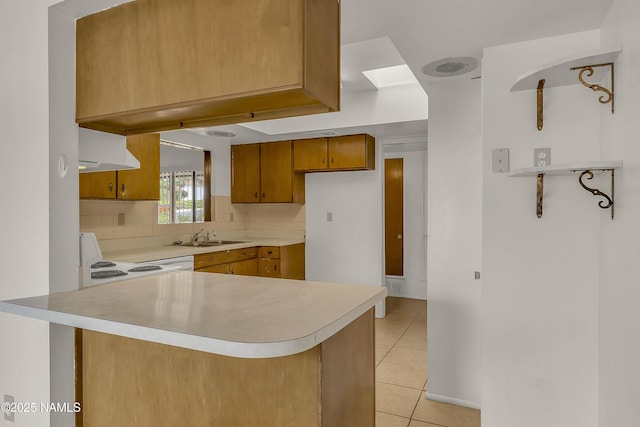3494 N Andes Dr, Flagstaff, AZ 86004 - kitchen with range hood, light countertops, white range, a peninsula, and a sink