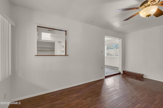 3494 N Andes Dr, Flagstaff, AZ 86004 - empty room featuring dark wood-style floors, ceiling fan, and baseboards