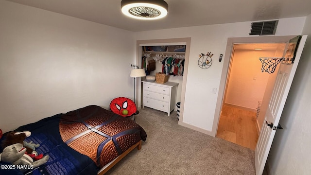 bedroom featuring carpet floors, a closet, and baseboards