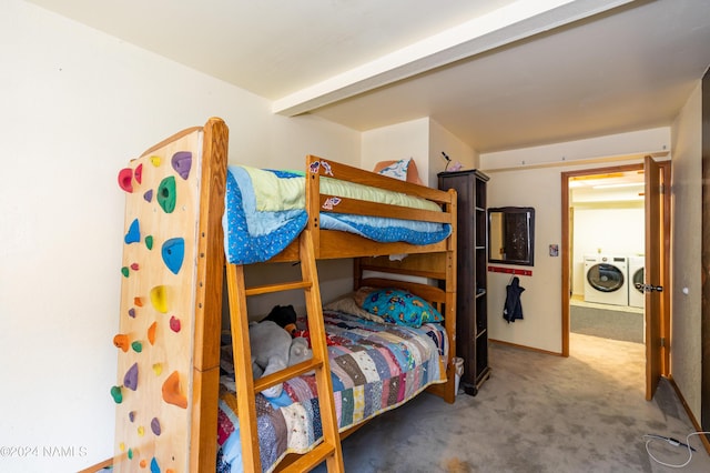 carpeted bedroom featuring separate washer and dryer