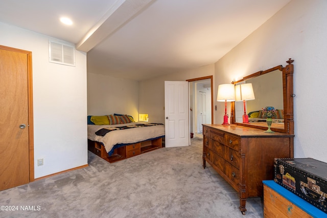 bedroom featuring light carpet