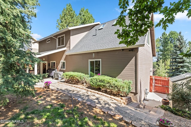 rear view of house with a patio