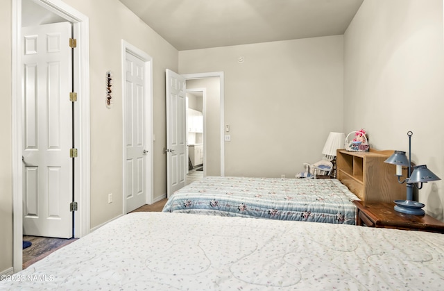 bedroom with hardwood / wood-style flooring