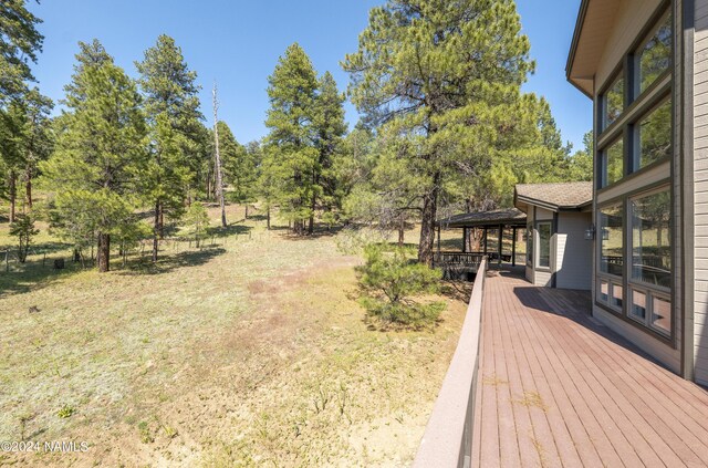 view of yard featuring a gazebo and a wooden deck