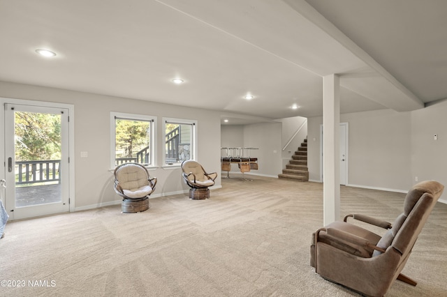 sitting room featuring light colored carpet