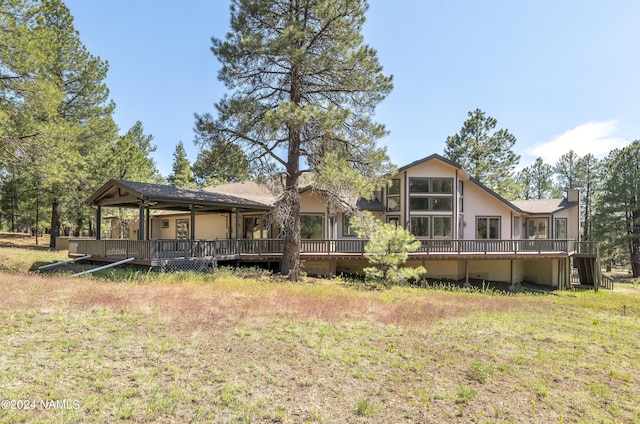 rear view of house with a yard