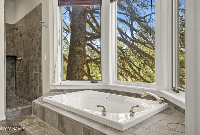 bathroom featuring separate shower and tub