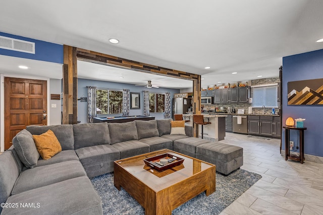 living room with sink and billiards