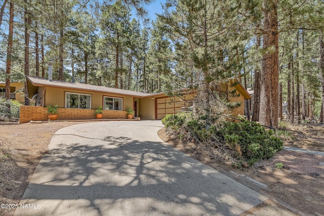 ranch-style house featuring a garage