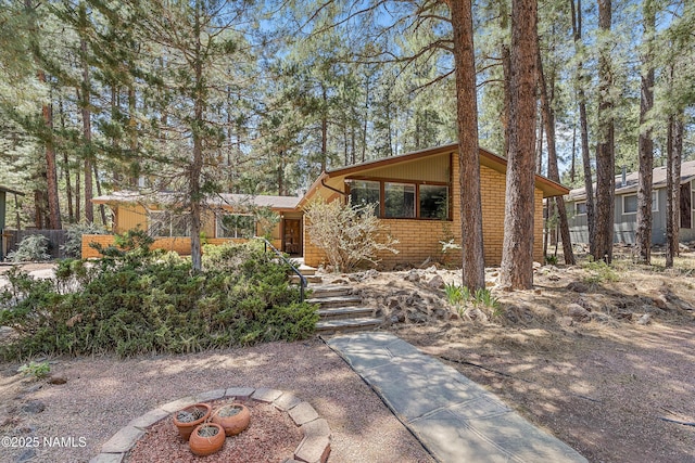 view of front of house with a fire pit