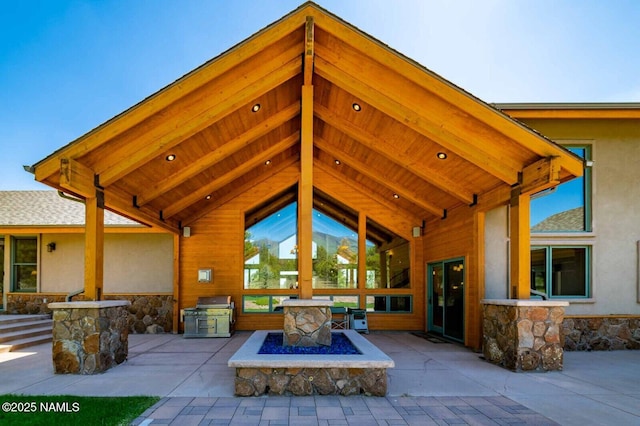 9178 N Snowbowl Ranch Rd, Flagstaff, AZ 86001 - view of patio / terrace featuring a fire pit and exterior kitchen