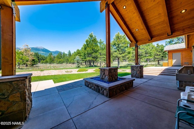9178 N Snowbowl Ranch Rd, Flagstaff, AZ 86001 - view of patio with a mountain view and view of scattered trees