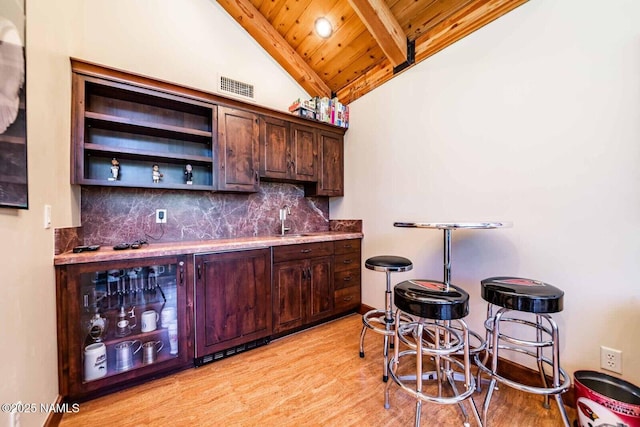 9178 N Snowbowl Ranch Rd, Flagstaff, AZ 86001 - indoor bar featuring wood ceiling, light wood-style flooring, and tasteful backsplash