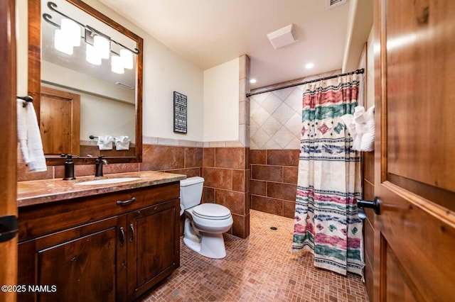 9178 N Snowbowl Ranch Rd, Flagstaff, AZ 86001 - full bathroom with vanity, tiled shower, tile walls, and recessed lighting