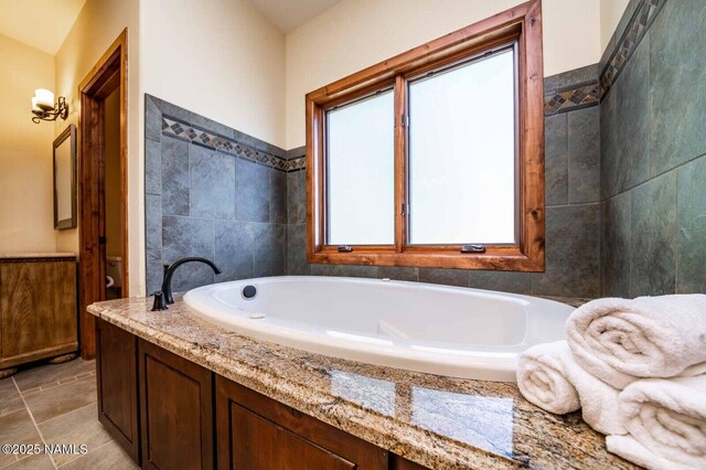 9178 N Snowbowl Ranch Rd, Flagstaff, AZ 86001 - full bathroom featuring a garden tub and tile walls
