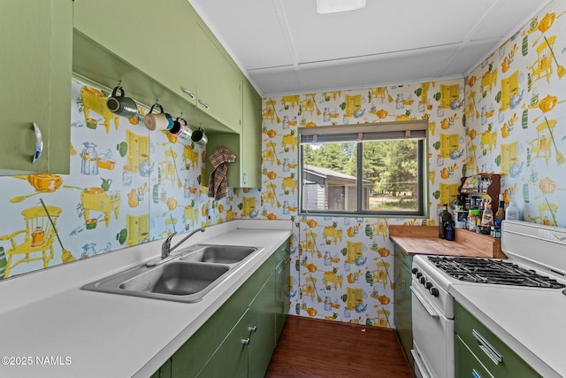 5735 White Tail Ln, Flagstaff, AZ 86005 - kitchen featuring green cabinetry, wallpapered walls, white gas stove, a sink, and light countertops