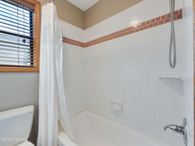 bathroom with shower / bathtub combination with curtain and toilet