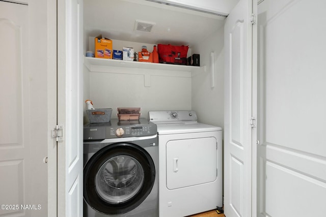 2548 S Gravel Ln, Flagstaff, AZ 86001 - laundry room featuring visible vents, washer and dryer, and laundry area