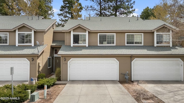 2548 S Gravel Ln, Flagstaff, AZ 86001 - view of property with a garage, concrete driveway, and a shingled roof