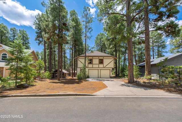 3480 S Moore Cir, Flagstaff, AZ 86005 - view of front facade featuring a garage, driveway, and stucco siding
