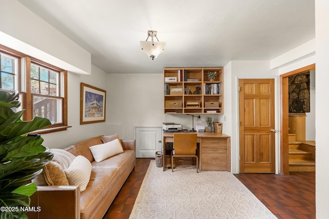 3480 S Moore Cir, Flagstaff, AZ 86005 - home office featuring built in desk and dark tile patterned flooring