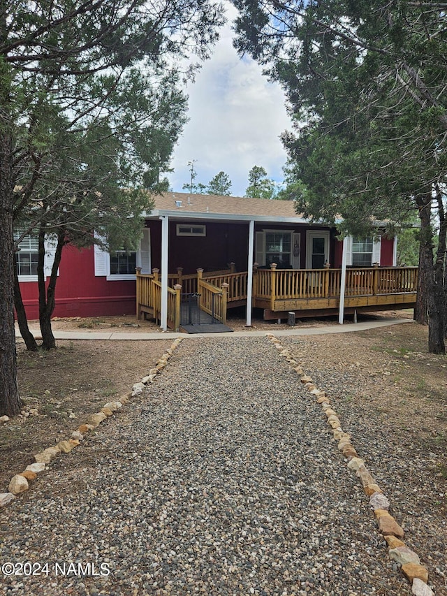 view of front of house featuring a wooden deck