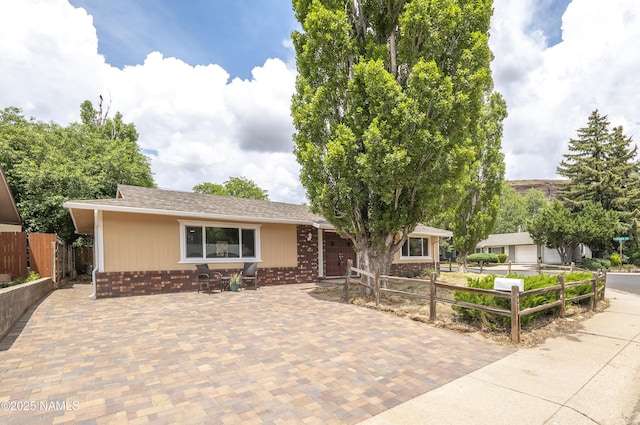 4972 E Snow Shoe Way, Flagstaff, AZ 86004 - ranch-style home with brick siding and roof with shingles