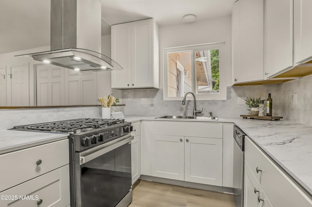 4972 E Snow Shoe Way, Flagstaff, AZ 86004 - kitchen featuring stainless steel gas range, ventilation hood, a sink, tasteful backsplash, and white cabinets