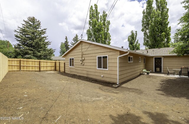 4972 E Snow Shoe Way, Flagstaff, AZ 86004 - back of house with a fenced backyard and a patio