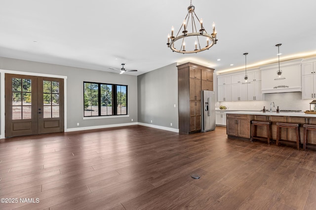 1031 Redwall Way, Williams, AZ 86046 - kitchen with baseboards, open floor plan, light countertops, high end fridge, and dark wood-type flooring